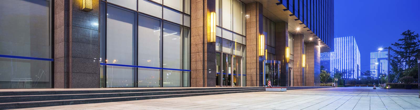 Photo of well-lit office building at night